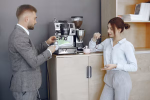 KAFVE | business-man-woman-office-coffee-break-hallway-big-corporation_1157-40478